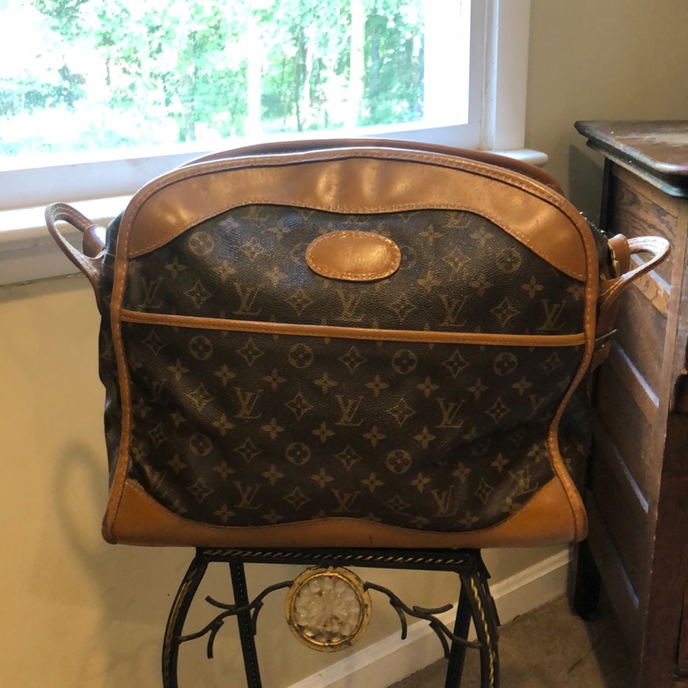 Vintage Louis Vuitton carry-on bag.